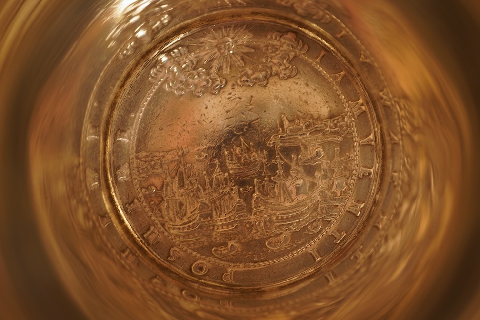 A white metal beaker the base inset with a silver medal commemorating the Peace of Oliva, 1660, Obv. Bird's-eye view of the city of Danzig with troops moving in foreground; above, an eagle crowned, an olive branch in its